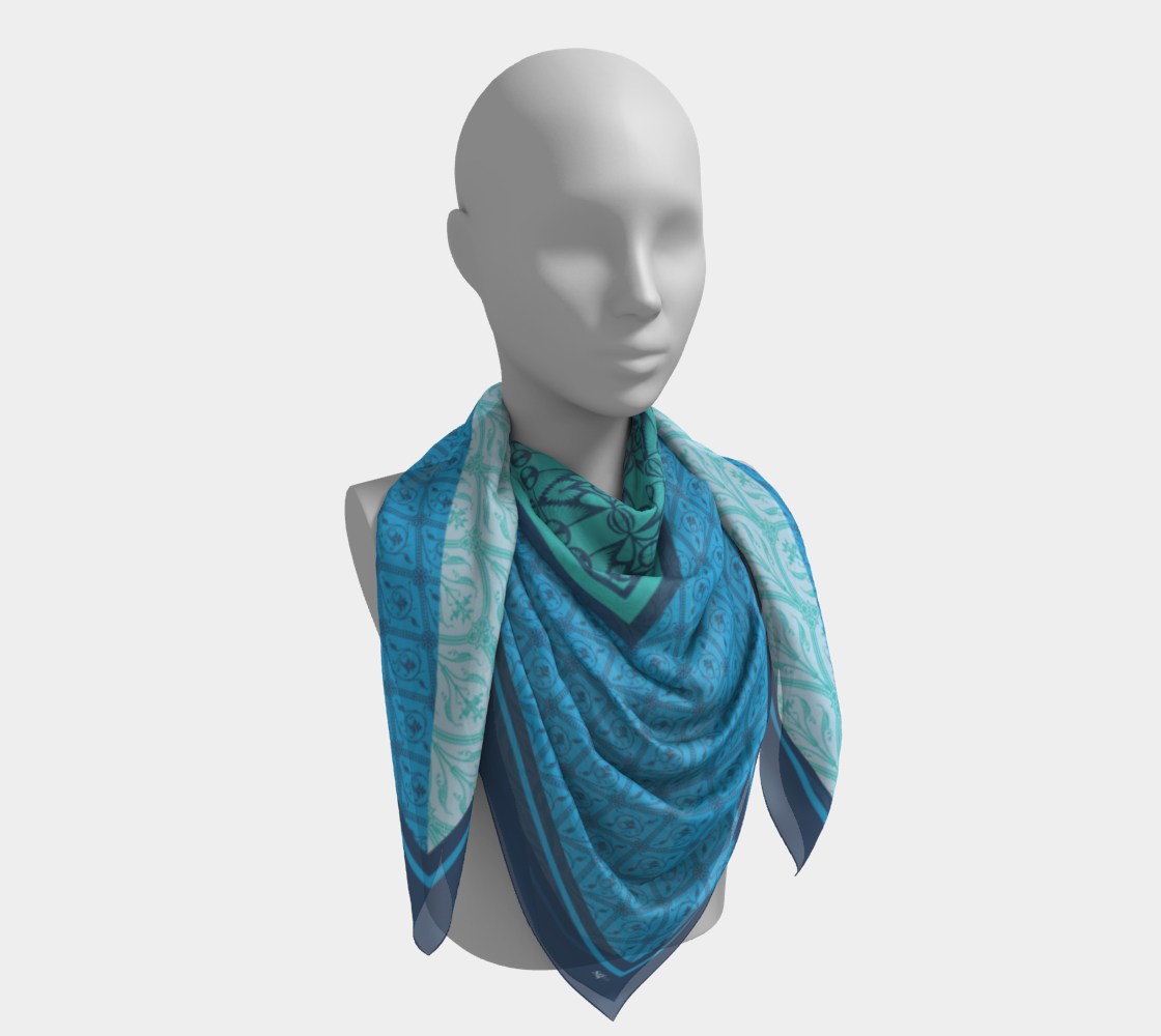 This silk scarf features a mix of contrasting patterns in beautiful shades of blue.