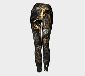 Black and Gold ethereal patterns evoke moon dust on these compression leggings.