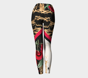 Red botanicals splash onto a gold splattered background on these compression leggings