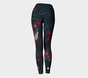Dark moody florals sit against a midnight sky on these compression leggings