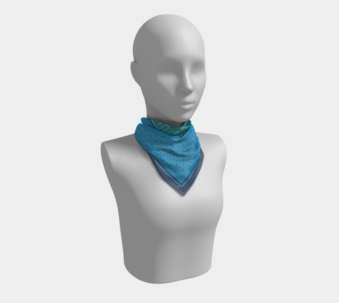 This silk scarf features a mix of contrasting patterns in beautiful shades of blue.