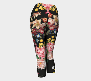 A deep black midnight acts as the background for brilliant beautiful florals on these capri length leggings