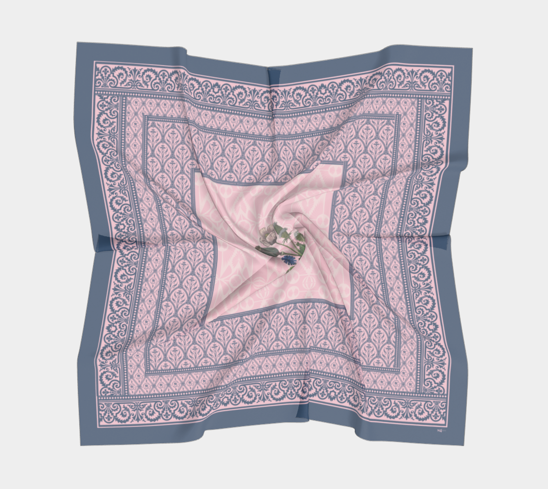 This silk scarf features contrasting patterns in pink and navy with a beautiful floral in the center.