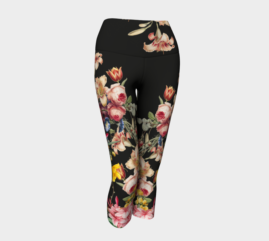 A deep black midnight acts as the background for brilliant beautiful florals on these capri length leggings