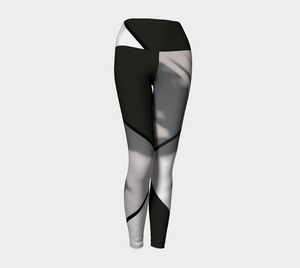 A bold black and white color blocking print adorn these high-waisted compression leggings