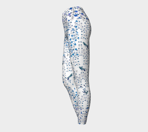 Compression leggings adorned with tiny blue florals and hummingbirds.