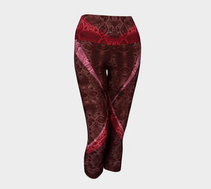 High waisted compression capris Featuring snakeskin color blocking in a red and pink color palette.