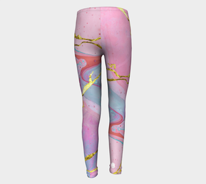 Ethereal prints mixed with pinks and pops of gold adorn these big kid leggings