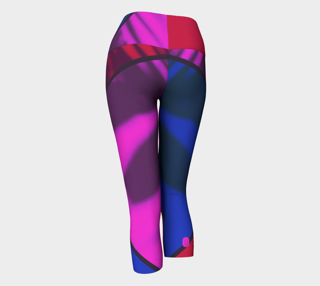 Bold pinks, reds and blues in a color blocking print remind you "who runs the world!?" on these capri compression leggings.