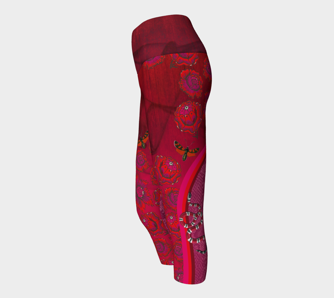 Billows of red clouds set amidst pink snakeskin, dusted with snakes and red butterflies on these capri length leggings