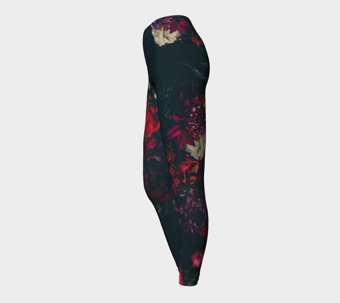 Dark moody florals sit against a midnight sky on these compression leggings