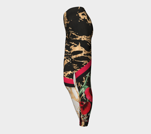 Red botanicals splash onto a gold splattered background on these compression leggings