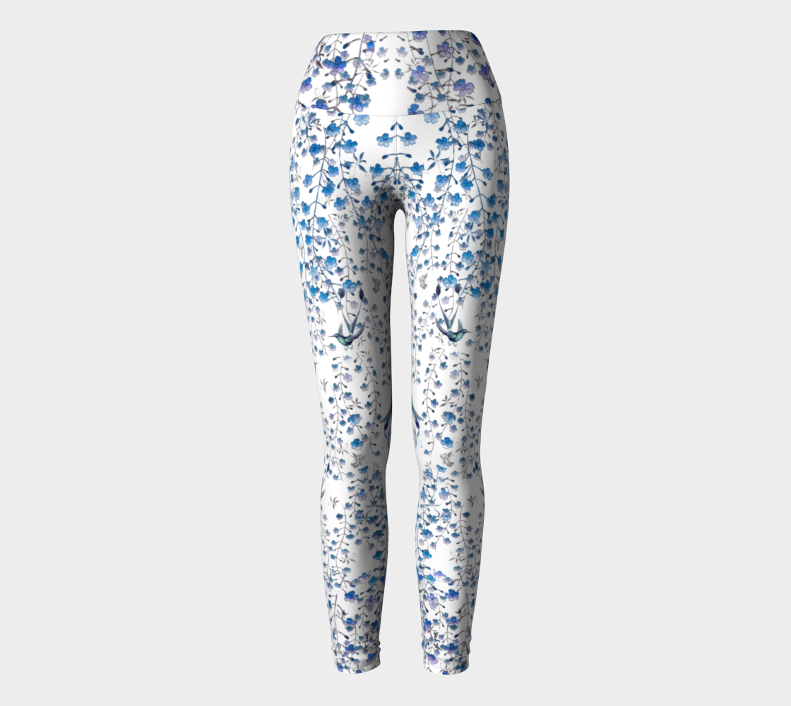 Compression leggings adorned with tiny blue florals and hummingbirds.