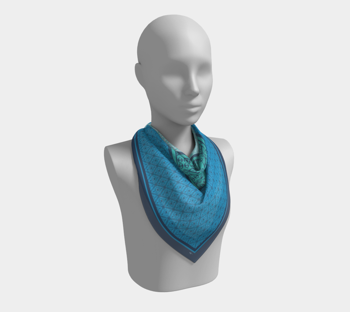This silk scarf features a mix of contrasting patterns in beautiful shades of blue.