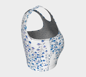 Tiny blue florals and hummingbirds dance across this full coverage athletic top.