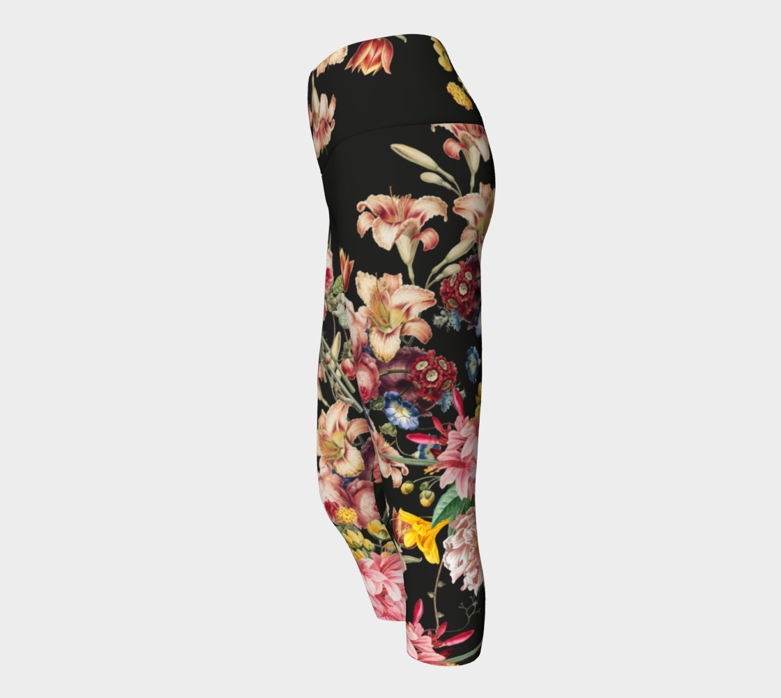 A deep black midnight acts as the background for brilliant beautiful florals on these capri length leggings