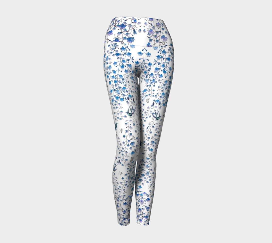 Compression leggings adorned with tiny blue florals and hummingbirds.