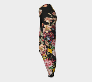 A deep black midnight acts as the background for brilliant beautiful florals on these compression leggings