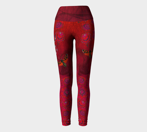 Billows of red clouds set amidst pink snakeskin, dusted with snakes and red butterflies on these compression leggings