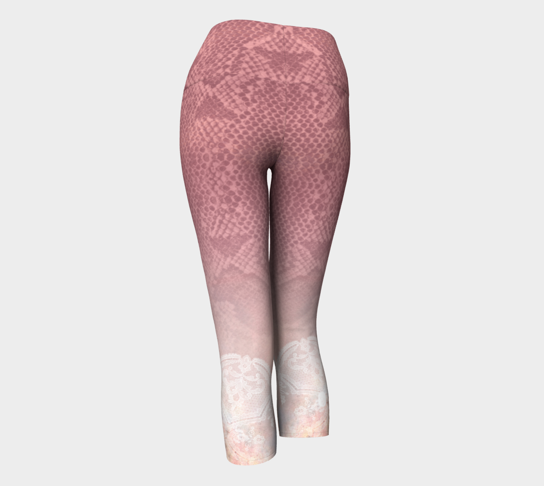 Pink hued snakeskin mingle with delicate lace on these capri length compression leggings
