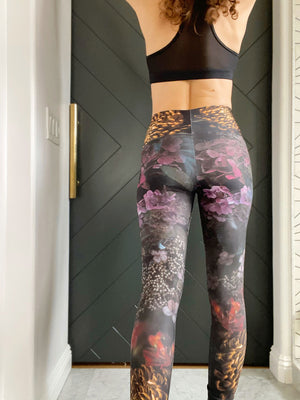 Moody dark florals adorn these high-waisted compression  leggings