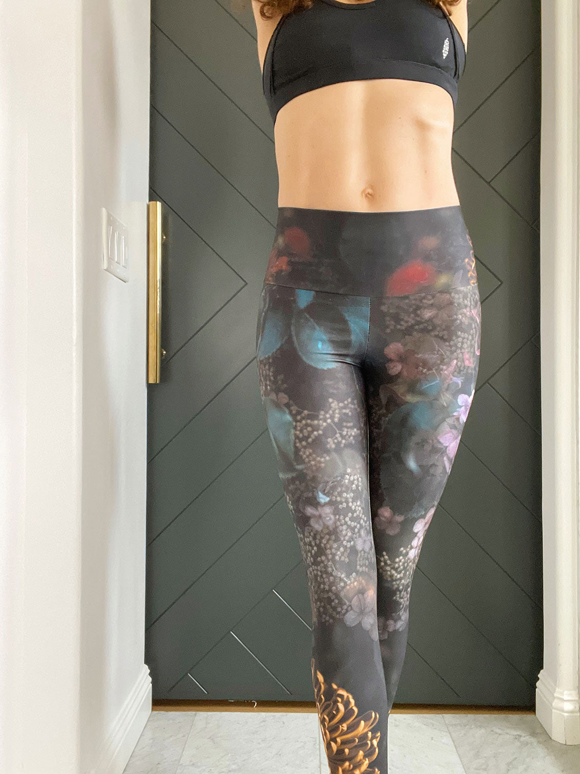 Moody dark florals adorn these high-waisted compression  leggings