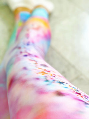 a playful pink candy inspired print adorn these high waisted compression leggings 