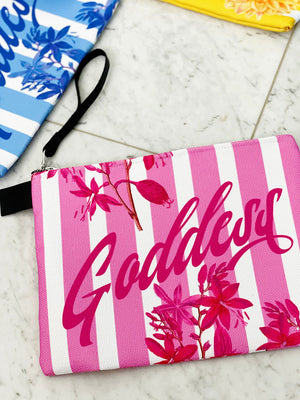 Pink florals and stripes adorn this luxe zipper pouch