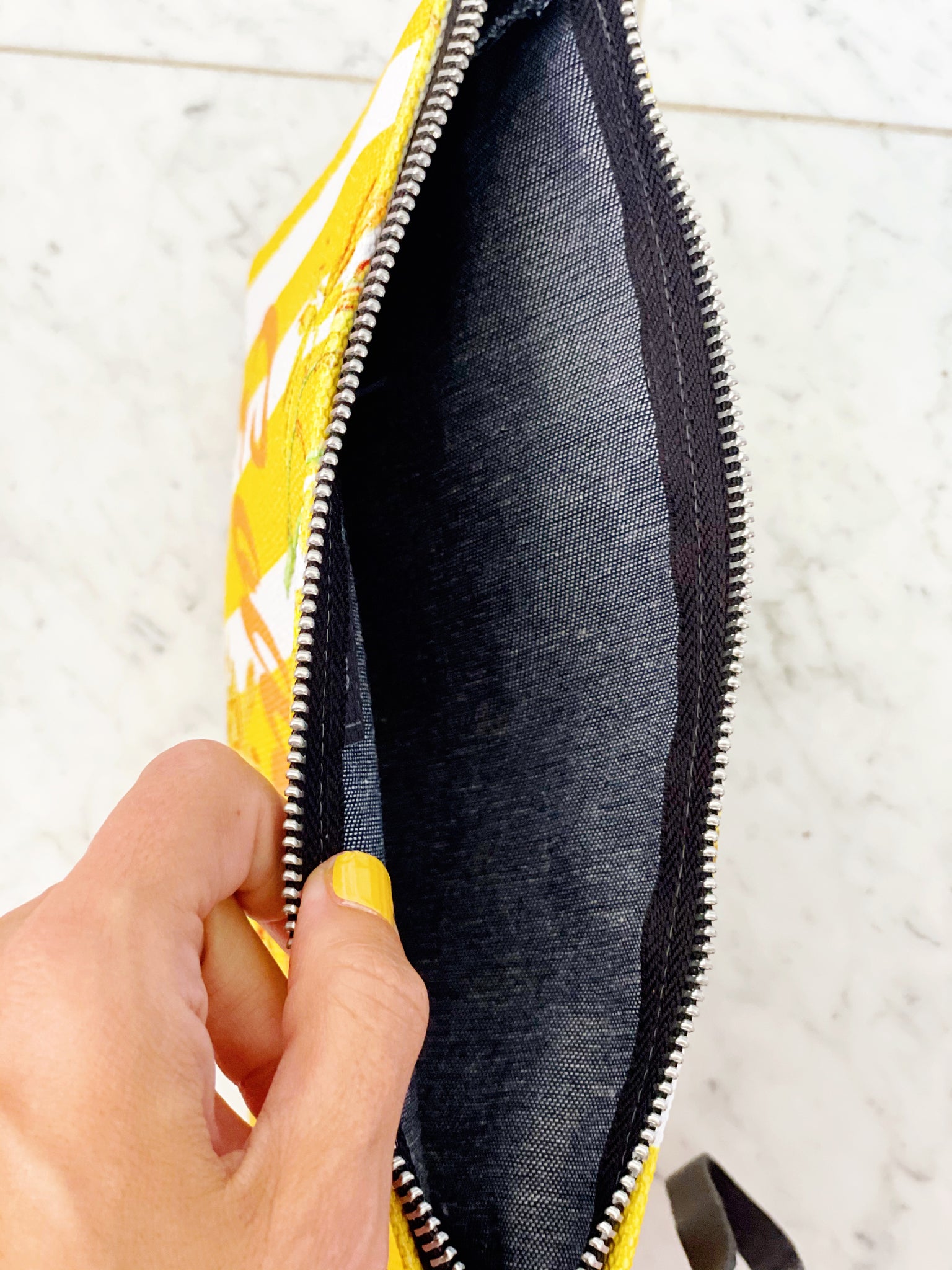 Luxe canvas pouch, fully lined with vegan leather details, featuring our yellow stripes and florals print with the word "Goddess" on the front.