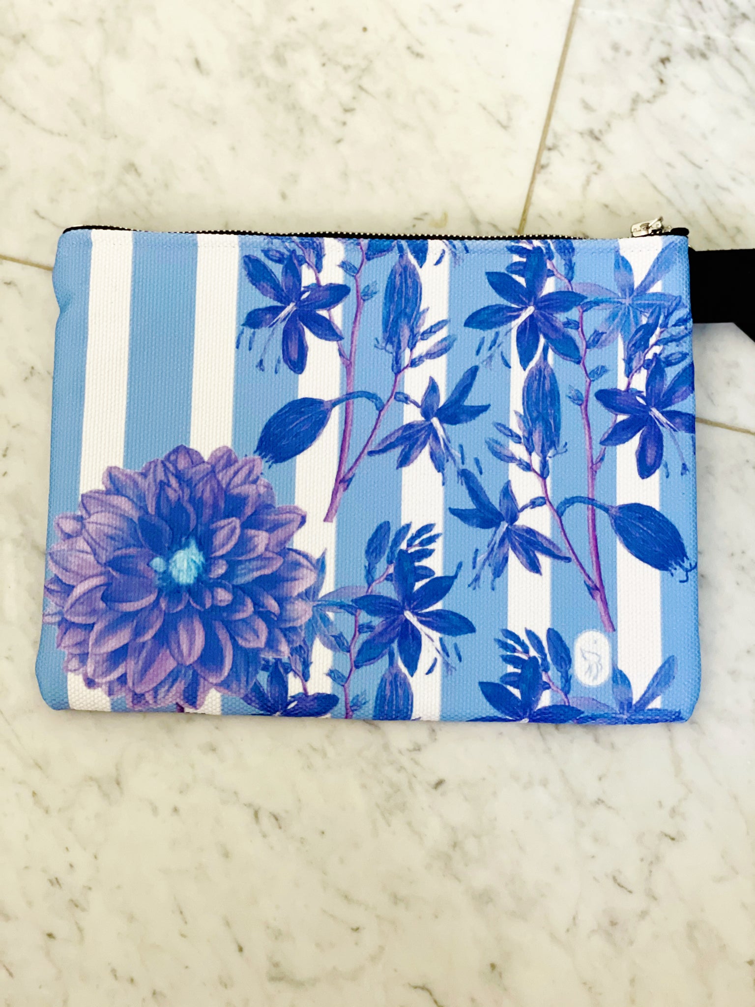 Luxe canvas pouch, fully lined with vegan leather details, featuring our blue stripes and florals print with the word "Goddess" on the front.