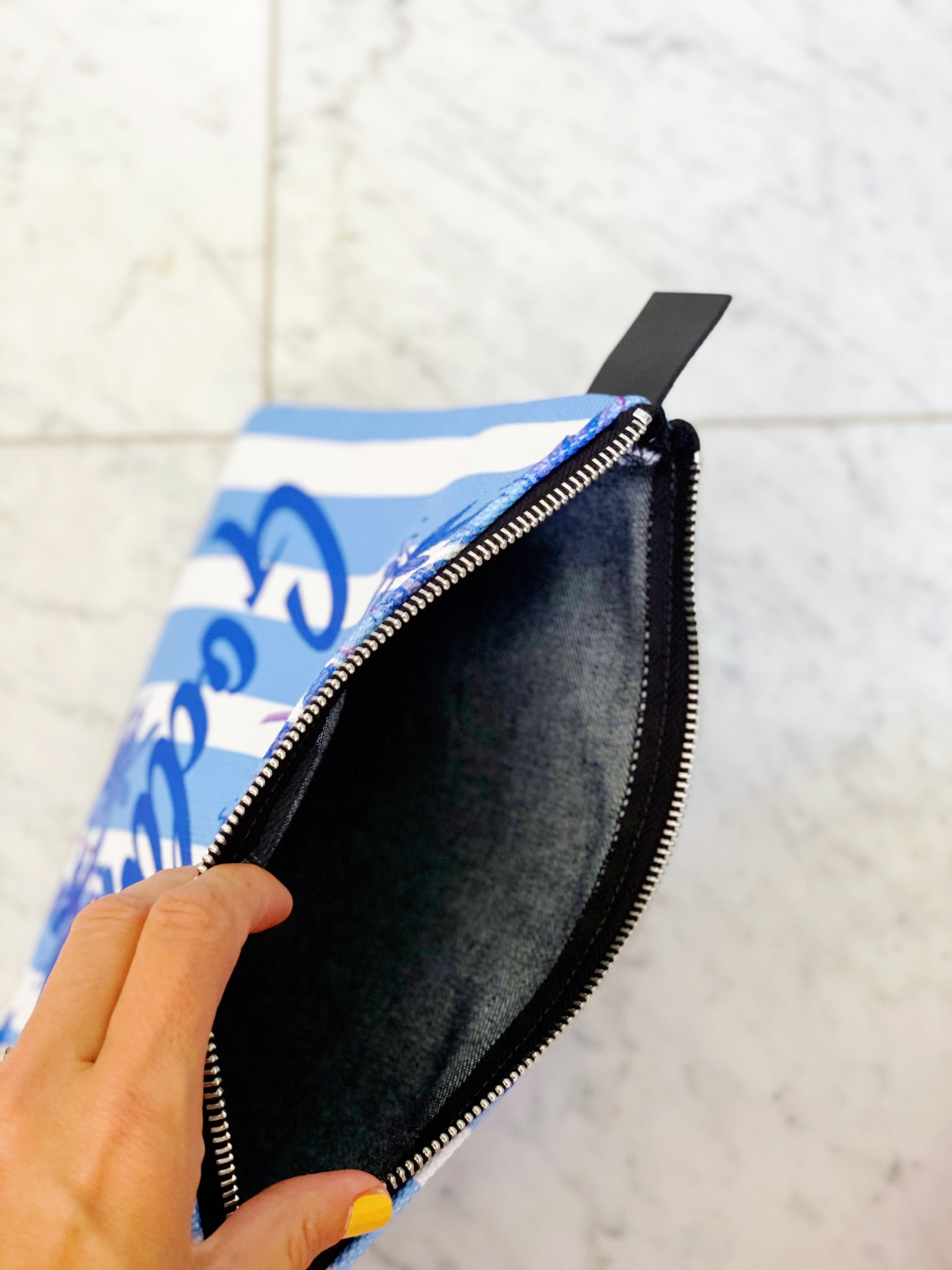 Luxe canvas pouch, fully lined with vegan leather details, featuring our blue stripes and florals print with the word "Goddess" on the front.