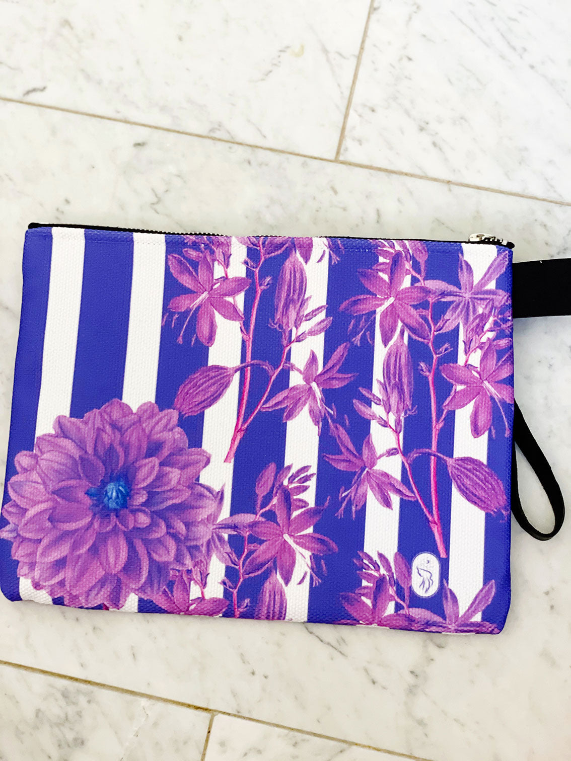 purple stripes and florals adorn this luxe zipper pouch