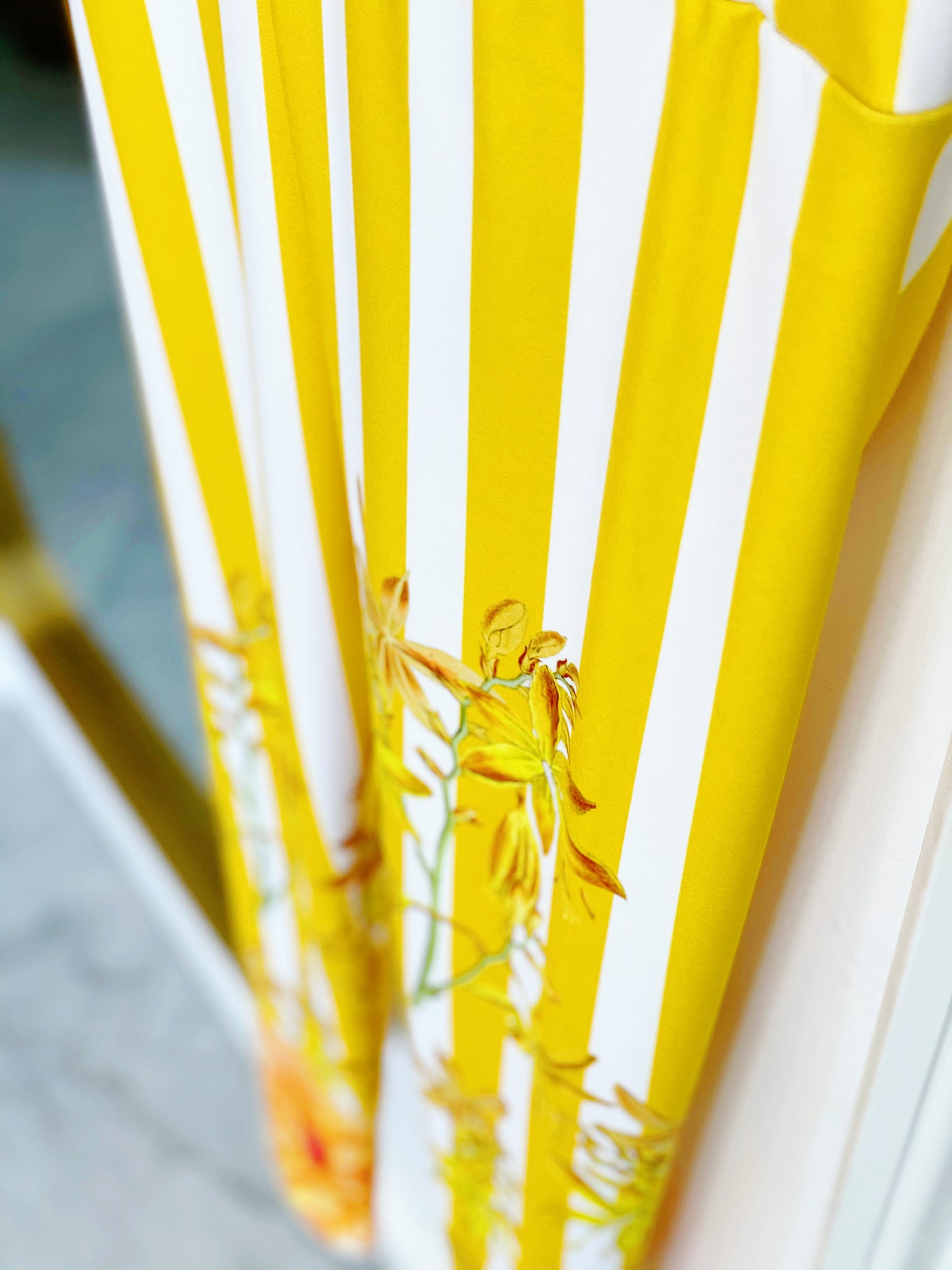 Bold yellow stripes and florals adorn these high waisted compression leggings