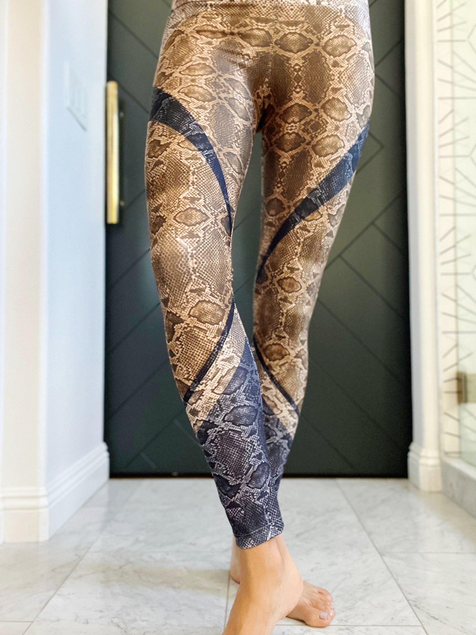 High waisted compression leggings in a natural color palette and snakeskin print.