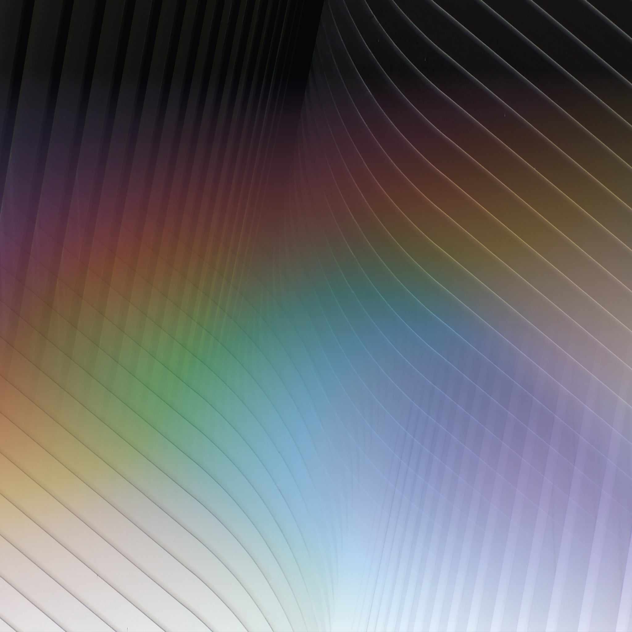 Geometrical patterns transform into rainbow colors, to create a stunning look on these capri length leggings