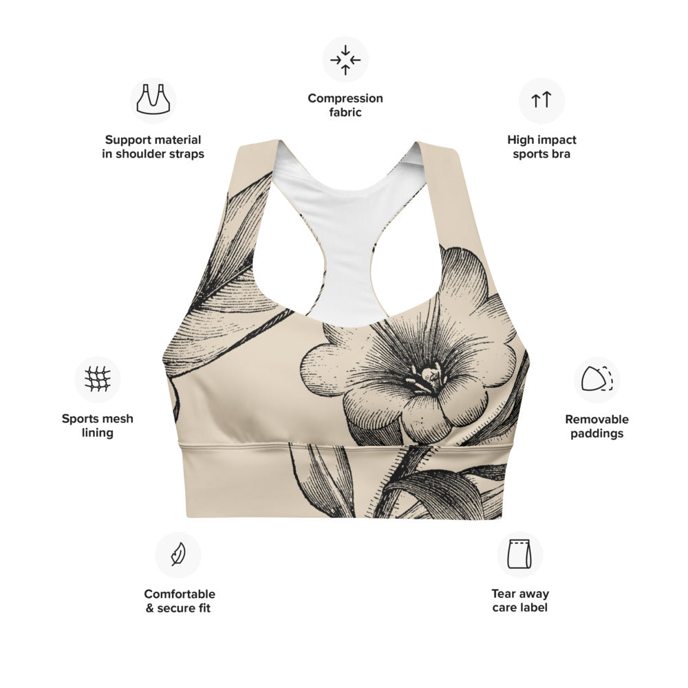Signature sports bra featuring vintage botanicals against an ivory background.