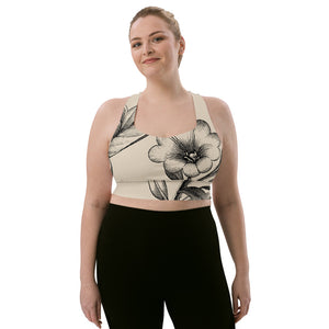 Signature sports bra featuring vintage botanicals against an ivory background.