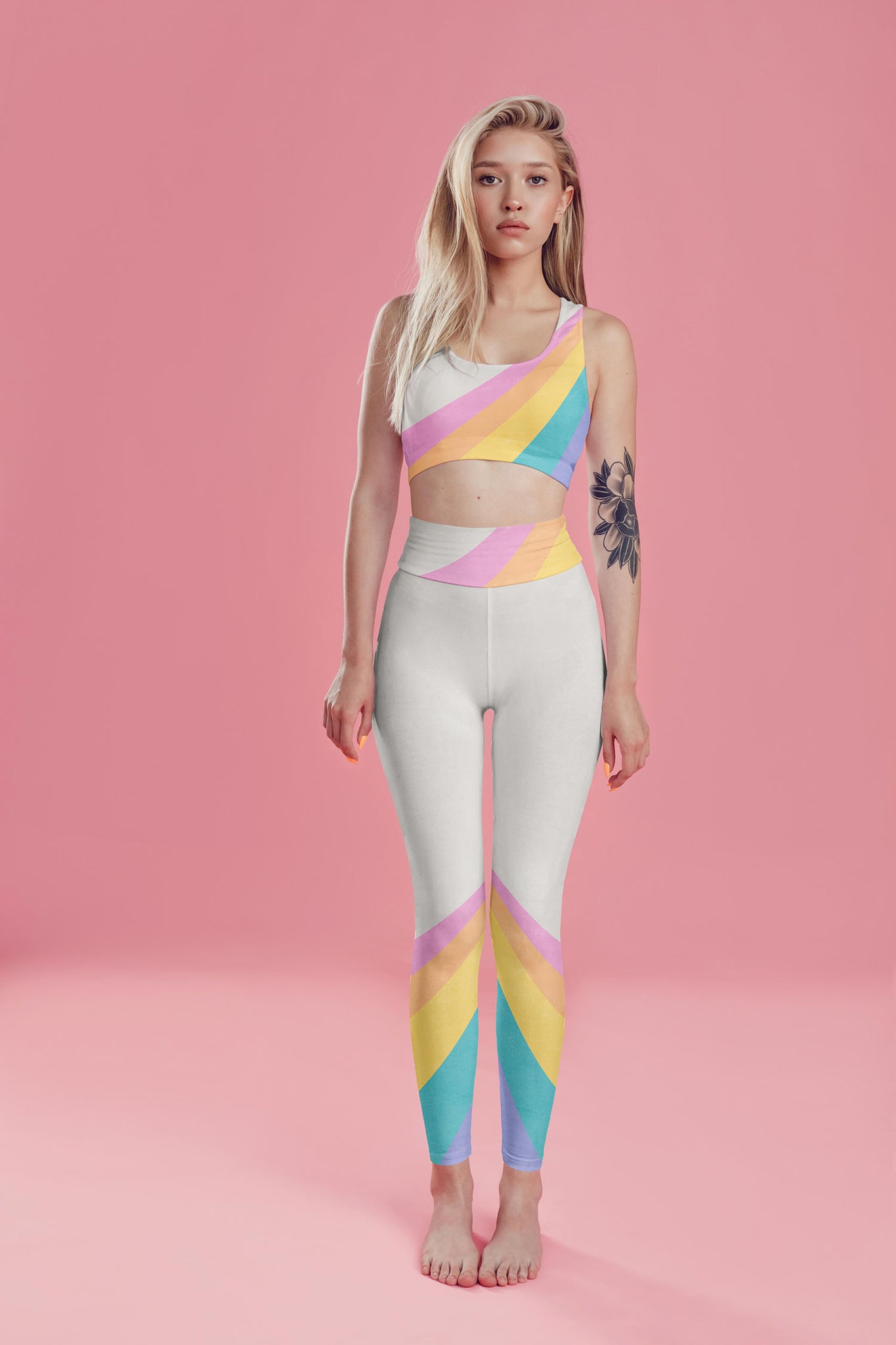 A color block style featuring a colorful rainbow adorn these compression leggings