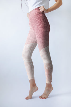 Pink hued snakeskin mingle with delicate lace on these high-waisted compression leggings