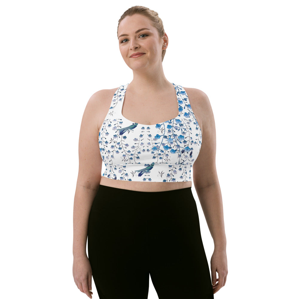 Our signature sports bra featuring tiny florals and hummingbirds