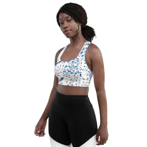 Our signature sports bra featuring tiny florals and hummingbirds