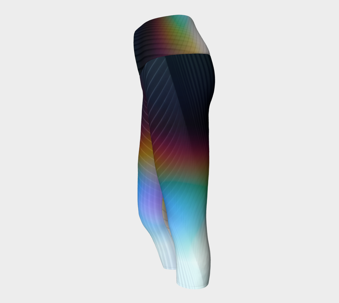 Geometrical patterns transform into rainbow colors, to create a stunning look on these capri length leggings