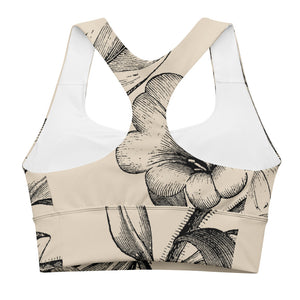 Signature sports bra featuring vintage botanicals against an ivory background.