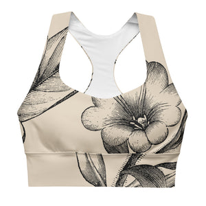 Signature sports bra featuring vintage botanicals against an ivory background.