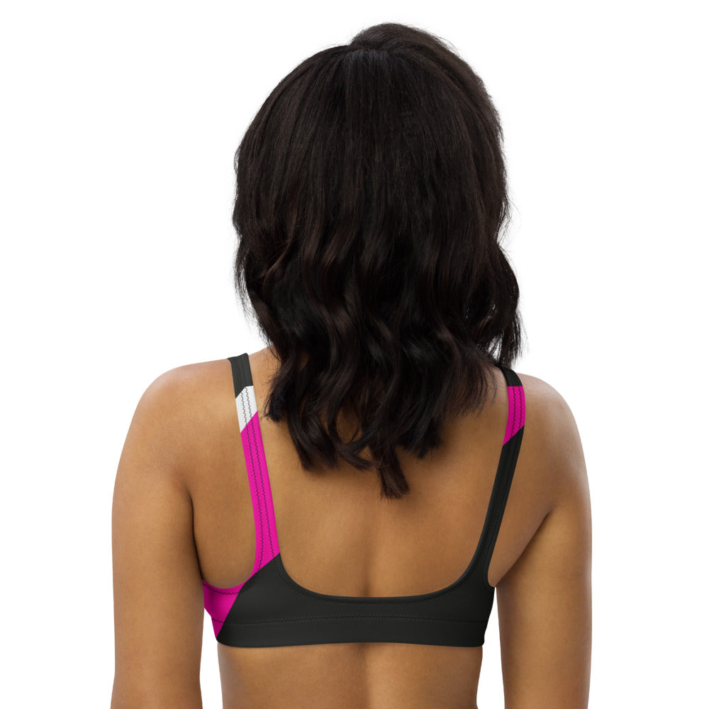 Recycled bikini sports bralette with removable pads in a pink, black and white color palette