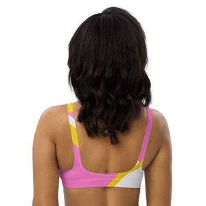 Recycled bikini sports bralette with removable pads in a playful pink, yellow and white color palette.