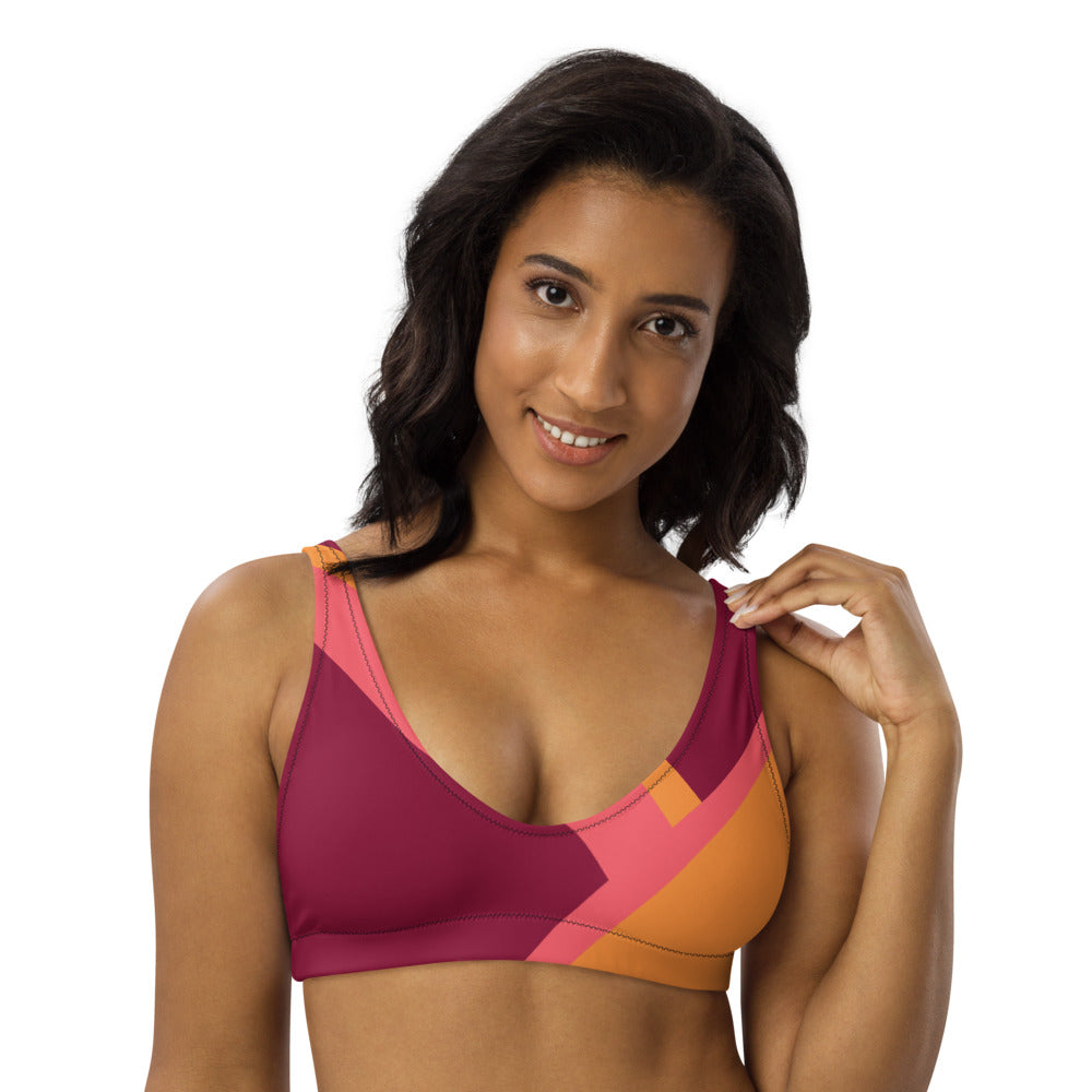 Recycled bikini sports bralette with removable pads with a wine and pink color blocking printRecycled bikini sports bralette with removable pads shown in a wine, orange and pink color palette