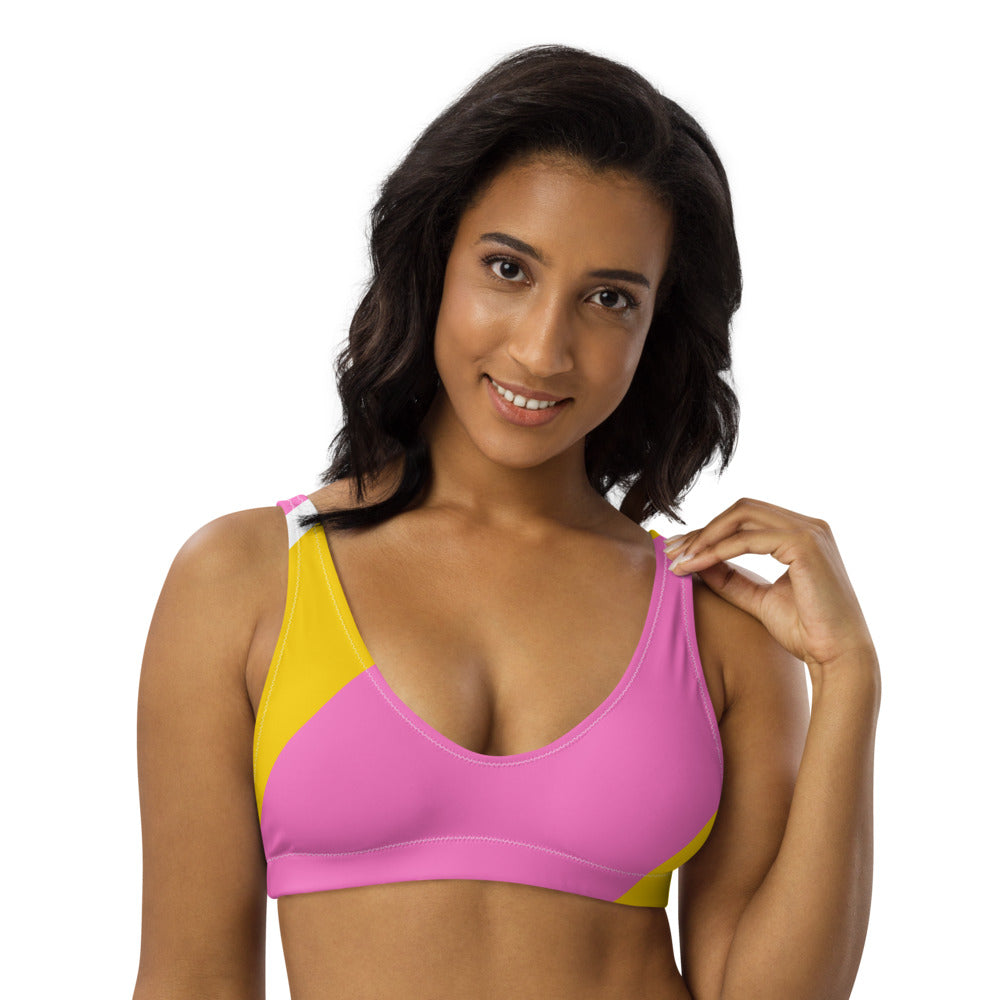 Recycled bikini sports bralette with removable pads in a playful pink, yellow and white color palette.