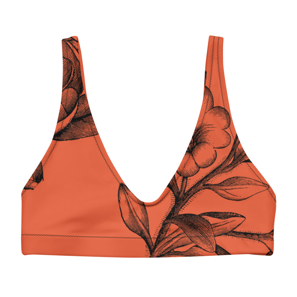 Black botanicals set against a red background on our signature sports bralette.