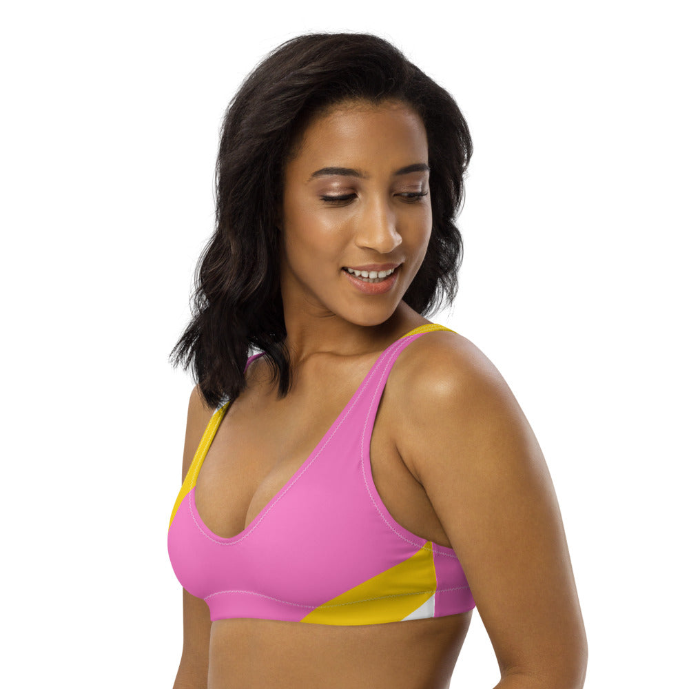 Recycled bikini sports bralette with removable pads in a playful pink, yellow and white color palette.